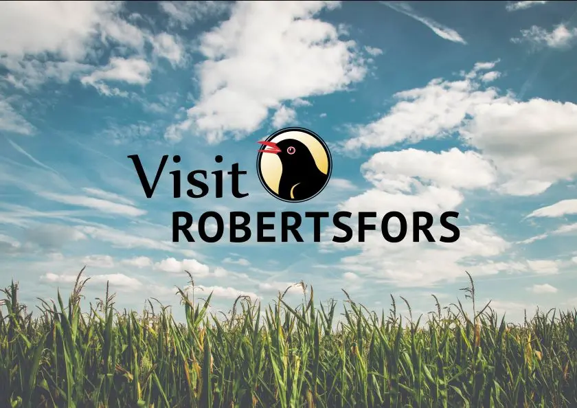 Visitrobertsfors logga på somrig bakgrund.